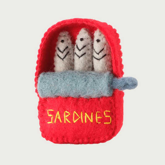 Wool cat toy, mimicking an opened can of sardines. The red can has its lid rolled back, to expose 3 sardines standing up inside. "Sardines" is embroidered in yellow on the front of the can.