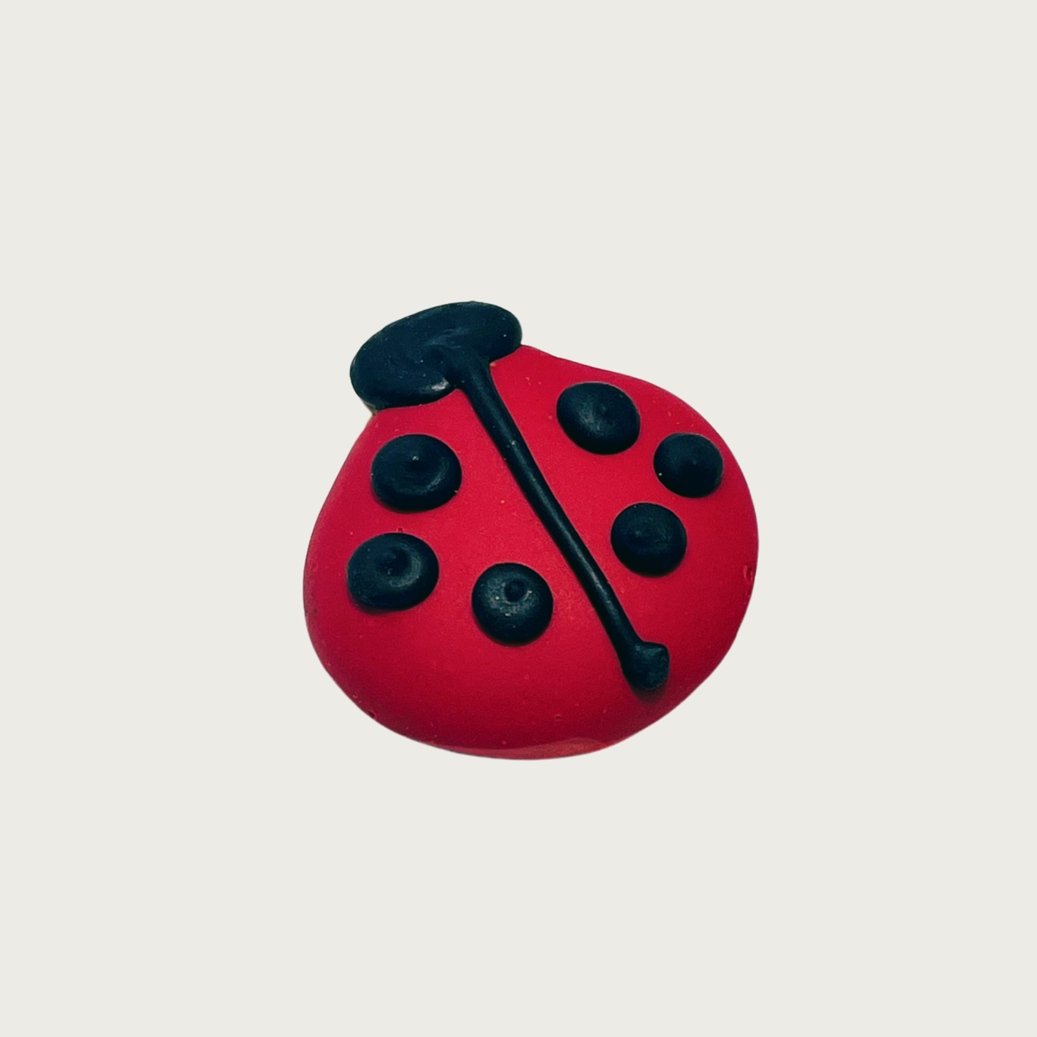 Decorated mini dog cookie shaped like a black & red ladybug.