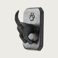 Load image into Gallery viewer, Dark metal, rectangular decorative wall hook that features a 3D dog rear end sticking out with its tail standing up. A paw print detail is on the flat part of the hook and is above the dog body.
