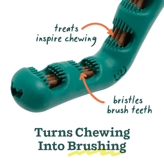 Closeup image of the Bite n' Brush, showing better detail of the bristles around the 4 center openings. Text reads: Turns Chewing into Brushing. Bristles brush teeth, treats inspire chewing.