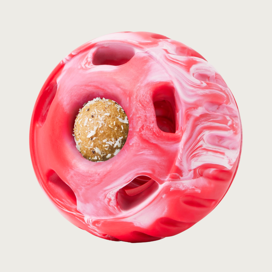 Red & white marbled, round Pupsicle toy. Center has a small, depressed, round open area for dog to access a treat. Around this opening, are 5 smaller slot-type openings (called "drool slots"), to provide additional access and collect excessive drool. Bottom half of toy is solid rubber with an indentation to twist toy apart.