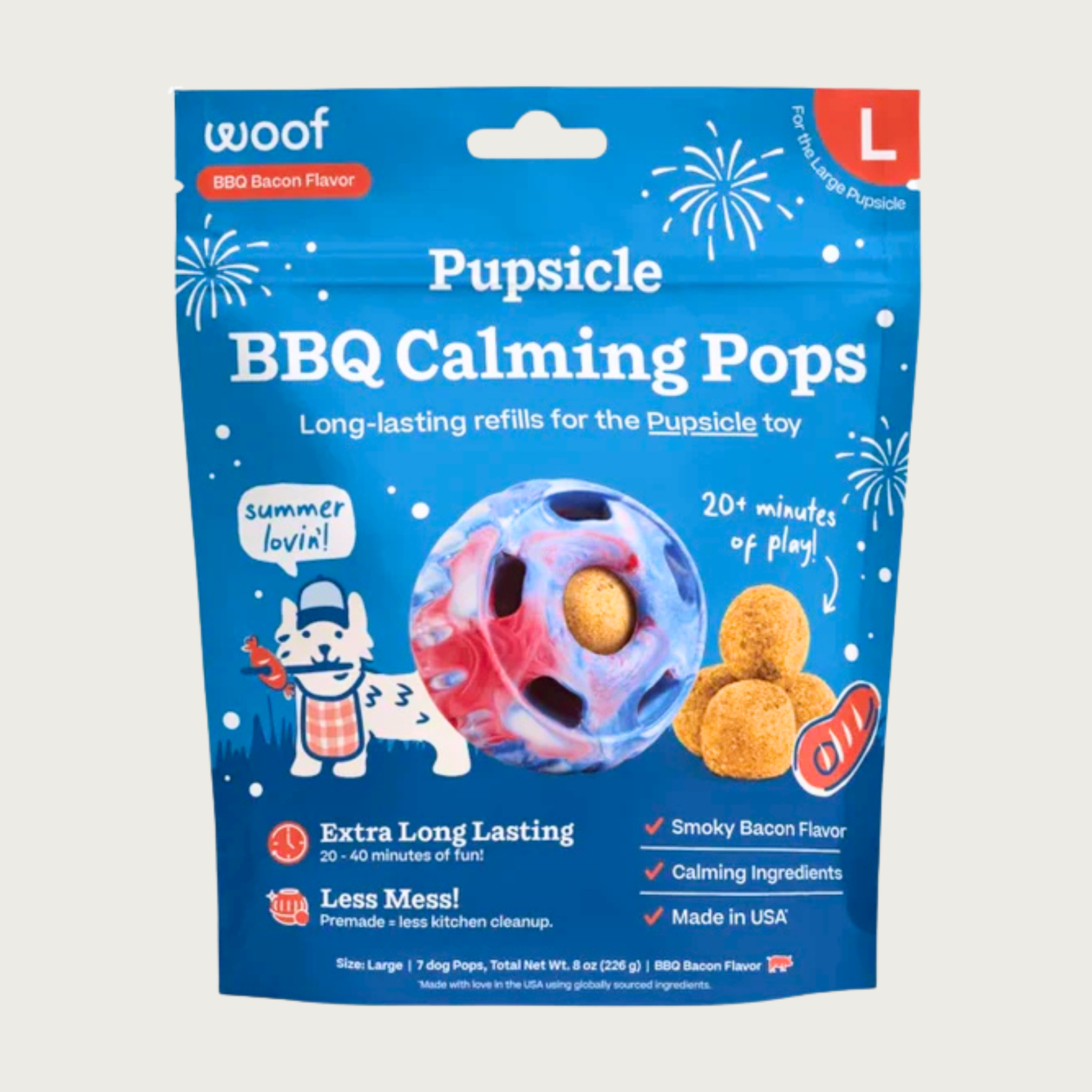7 ct bag of large Woof BBQ Calming Pops, long-lasting refill treats for the Pupsicle toy to promote calm. Extra long lasting, less mess. Image of red, white & blue tie-dyed Pupsicle toy is in center, with refill pop inside, with sample pops clustered to the right. They are round, tan colored balls, coated with bacon powder.