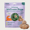 7 ct bag of large Woof Calming Wellness Pops, long-lasting refill treats for the Pupsicle toy to promote calm. Extra long lasting, less mess. Image of green Pupsicle toy is in center, with refill pop inside, with sample pops clustered to the right. They are round, peanut butter colored, smooth balls, coated with coconut flakes.