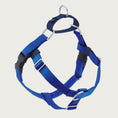Load image into Gallery viewer, Dog harness with bright blue nylon straps on the front and sides; loop on dog's back is navy blue. Chest strap is bright blue velvet. There are 2 black plastic clips, which fasten behind each front leg. 
