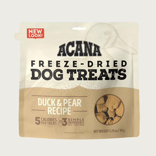 3.25 oz beige bag of Acana Freeze-Dried Dog Treats, Duck & Pear Recipe. 5 calories per treat, made with 3 simple ingredients. Small transparent window show product inside; small tan-colored, cube shaped treats.
