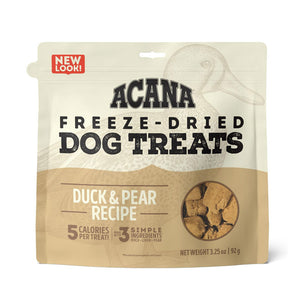 3.25 oz beige bag of Acana Freeze-Dried Dog Treats, Duck & Pear Recipe. 5 calories per treat, made with 3 simple ingredients. Small transparent window show product inside; small tan-colored, cube shaped treats.