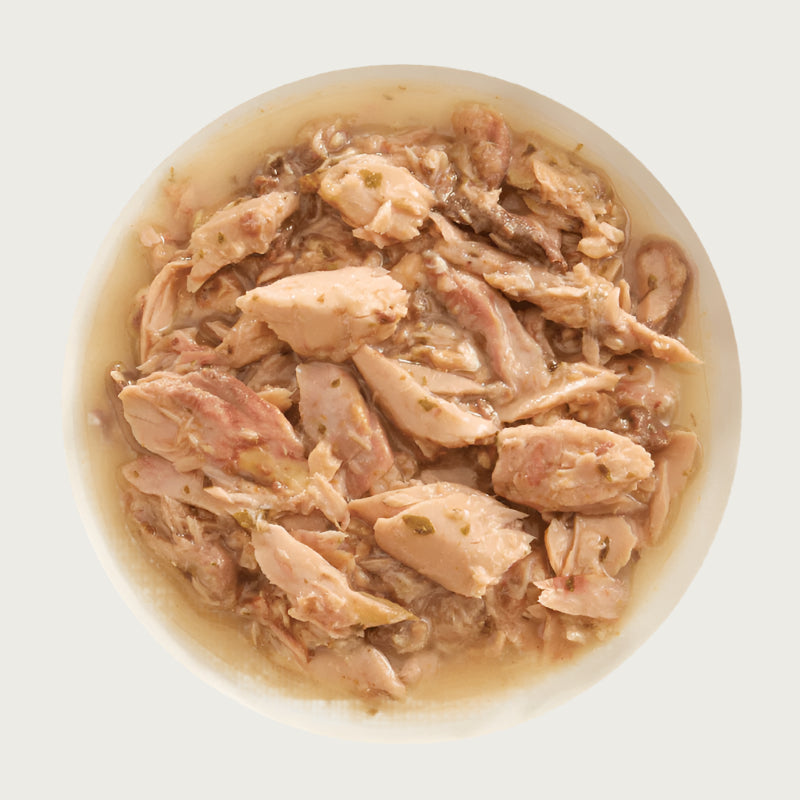 A bowl of Aujou by RAWZ Aku Tuna & Salmon recipe, showing large and small chunks of fish.