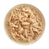 A bowl of Aujou by RAWZ Chicken Breast & Duck recipe, showing large chunks of chicken with smaller shreds and small pieces of duck.