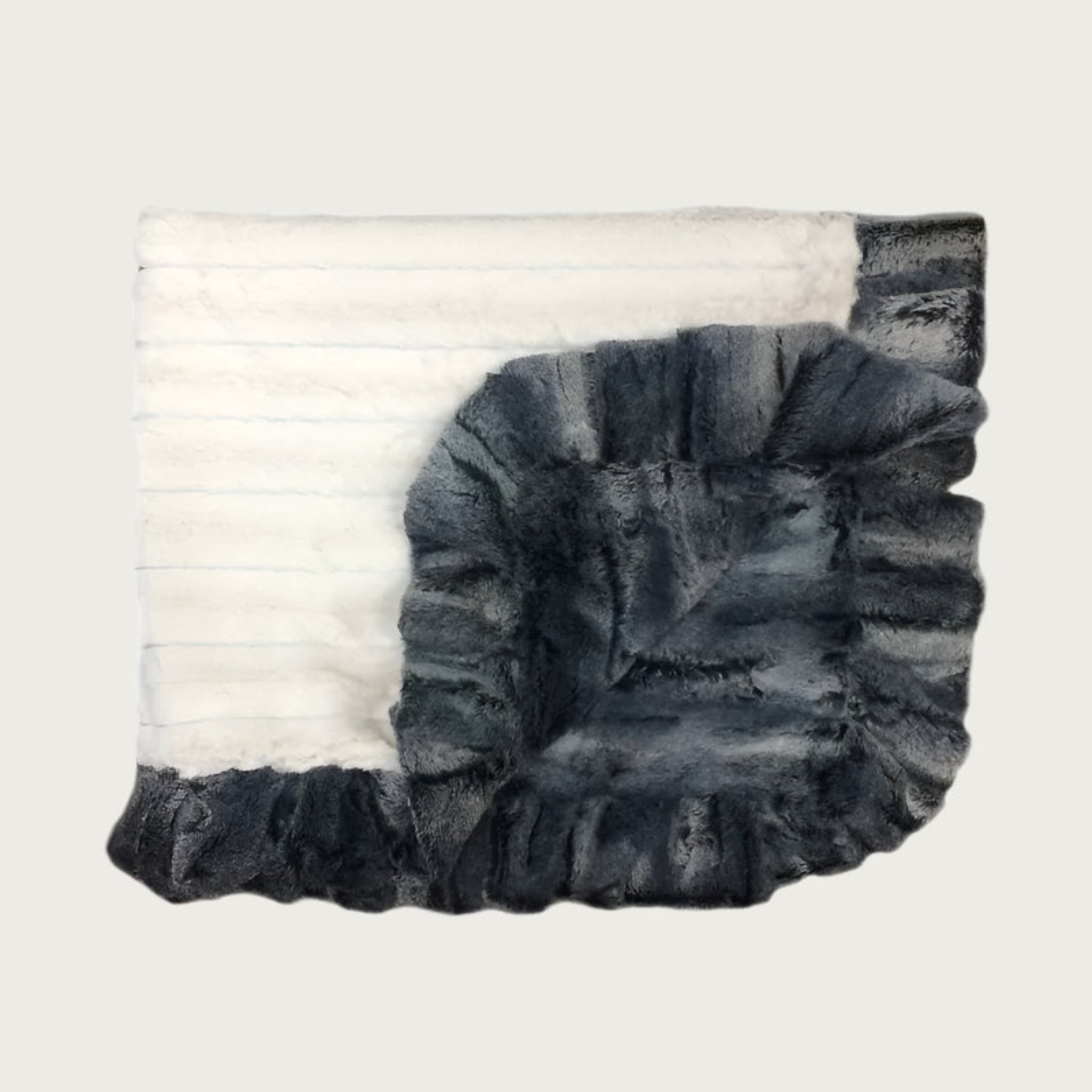 Faux mink fur pet blanket/throw in Whistler Black (shades of black, gray and cream in a subtle striped, textured pattern). Reverse is cream faux mink with the Whistler Black ruffled trim.