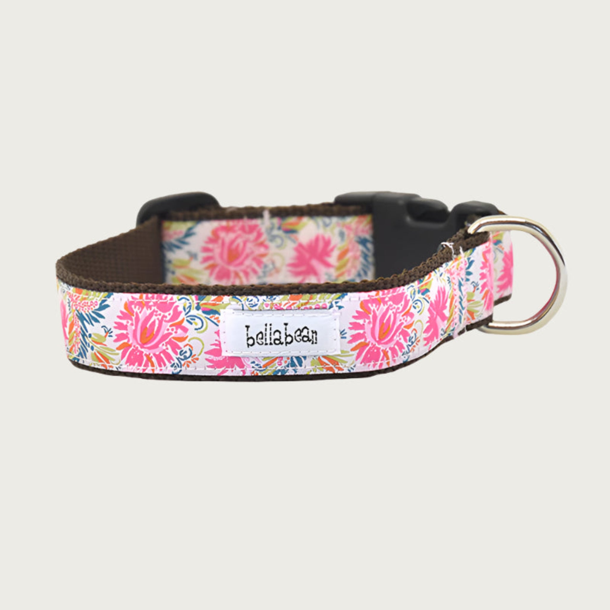 Dog collar with bright floral print (like peonies), in shades of pink, orange, green, and blue.