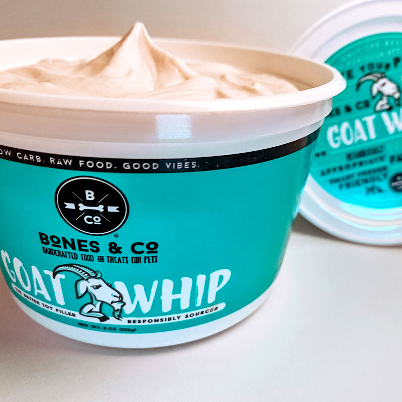 An open tub of Bones & Co Goat Whip to show product texture. Product is cream colored and appears to be thick and whipped to a peak.