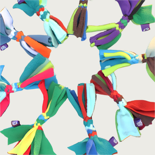A grouping of nine Chelsy's Toys Cat Candy toys for cats, showing an example of some of the many possible color variations. Sample colors include: red, orange, white, yellow, purple, green, blue, pink and brown.