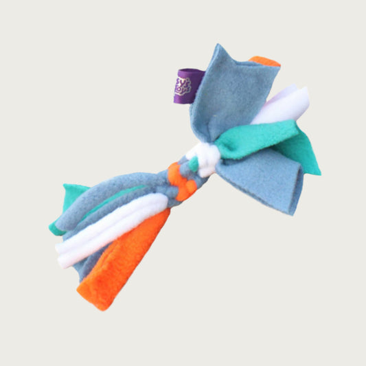 Photo of a sample Cat Candy fleece toy from Chelsy's Toys. Its midsection is knotted and it has loose fleece ends, and is multi-colored, featuring light blue, light teal, white and orange.
