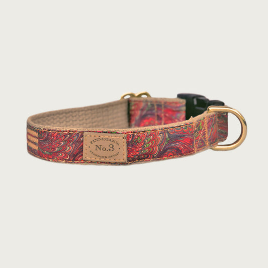 Dog collar with a marbled, paisley-style pattern in rich multi colored tones. Black plastic buckle and brass D-ring.