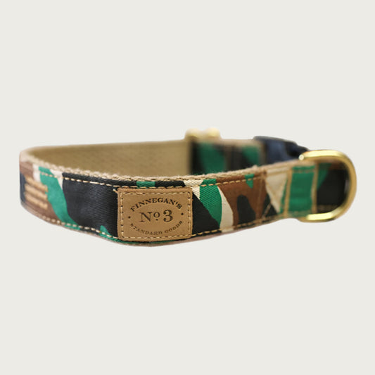 Dog collar with a camouflage pattern in green, black, and shades of brown.