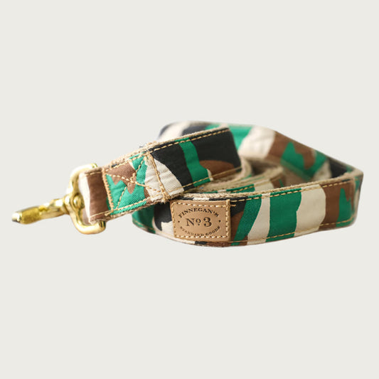Dog leash with a camouflage pattern in green, black, and shades of brown.