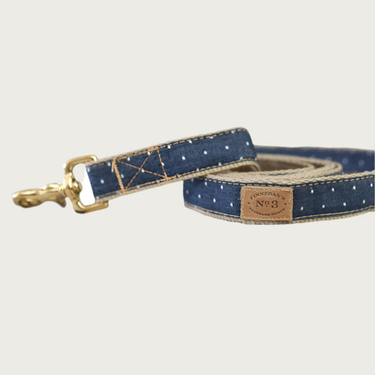 Dark blue denim dog leash with small repeating white dots pattern.