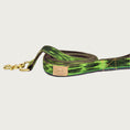 Load image into Gallery viewer, Dog leash with asymmetrical striped pattern in vibrant shades of green.
