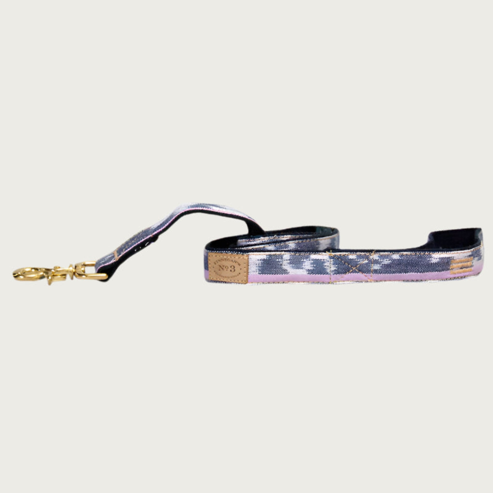 Dog leash with abstract stripe-like pattern, in shades of pale purple, pink and navy blue.