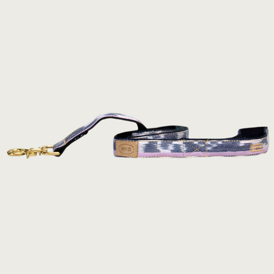 Dog leash with abstract stripe-like pattern, in shades of pale purple, pink and navy blue.