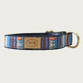 Load image into Gallery viewer, Dog collar with a serape blanket-inspired design, in rich shades of blue, brown and white with orange accents.
