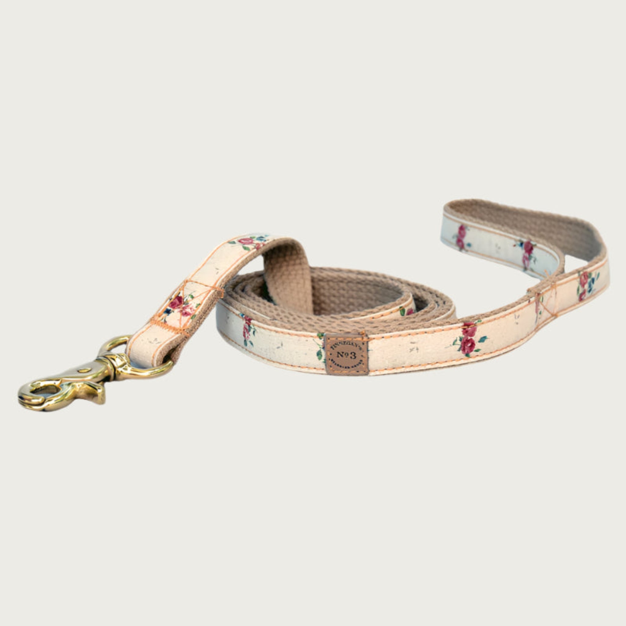 Dog leash with a cream base color, featuring sparse, scattered burgundy rose bouquets.