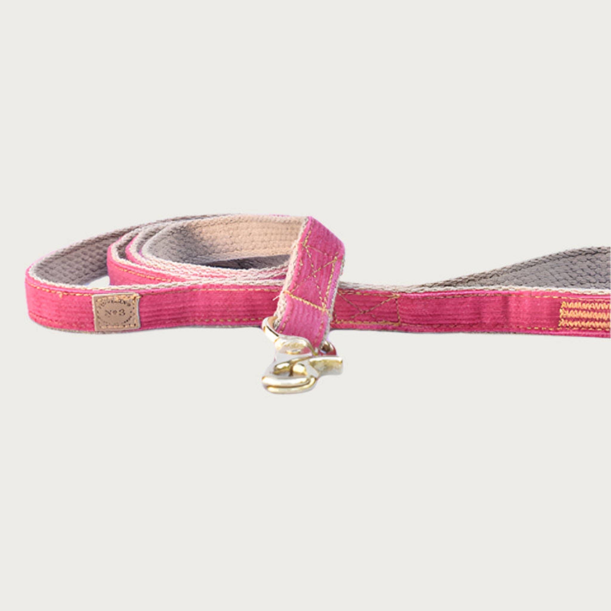 Bubblegum pink corduroy dog leash with brass clasp.
