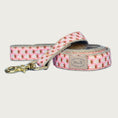 Load image into Gallery viewer, Dog leash with pink base color, and tightly repeating, white strawberries pattern with brown "seeds" and "stem" detail.
