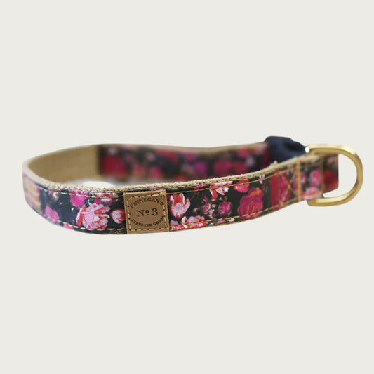 0.75" wide dog collar with black base color and rose pattern in shades of pink and red.