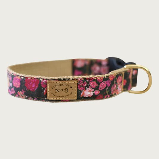 1" wide dog collar with black base color and rose pattern in shades of pink and red.