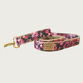 Load image into Gallery viewer, Dog leash with black base color and rose pattern in shades of pink and red.
