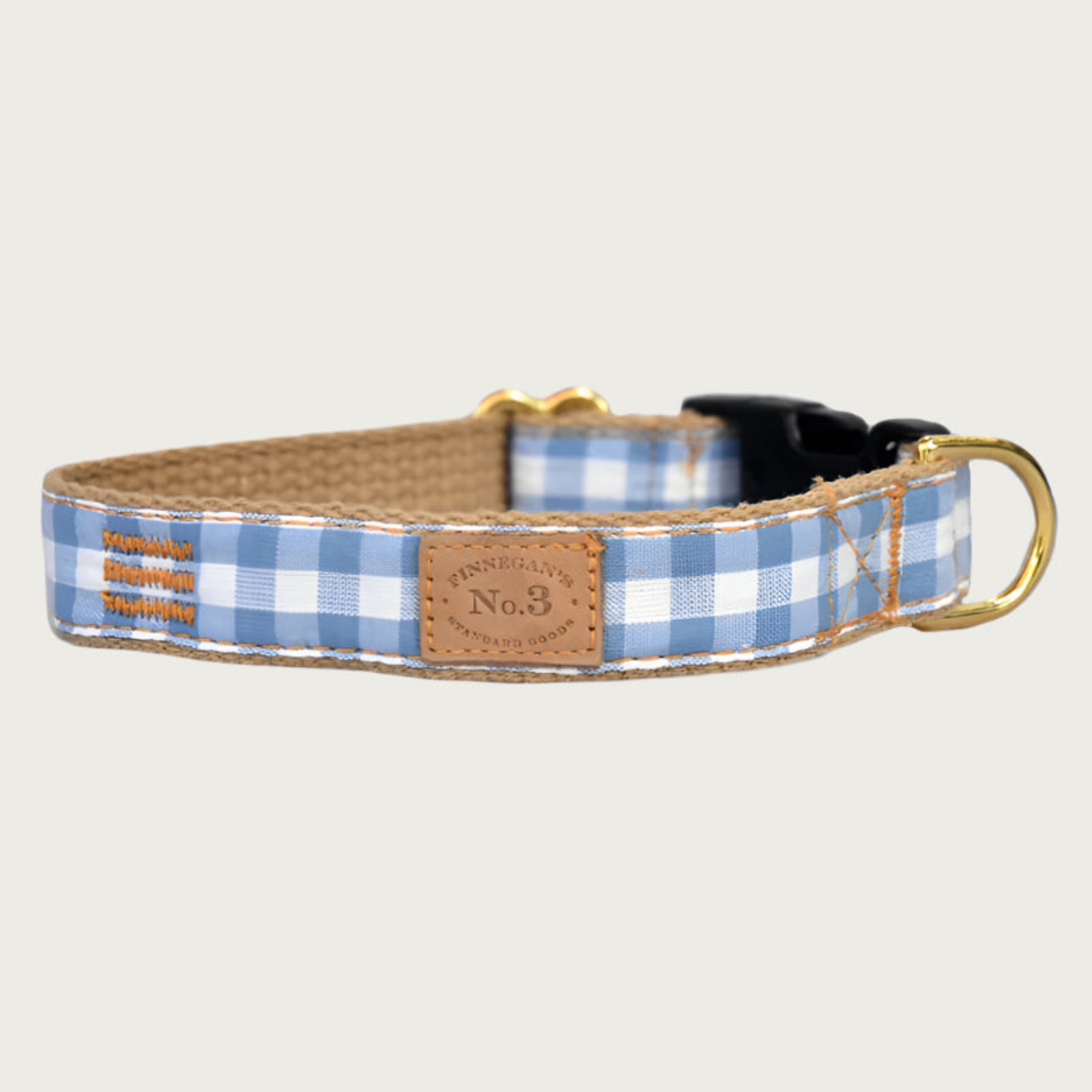 Dog collar with medium blue and white gingham check pattern.