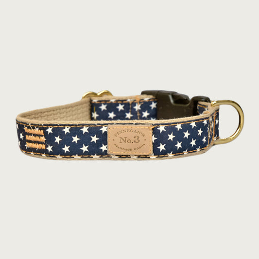 Deep navy blue dog collar with small repeating white star pattern.