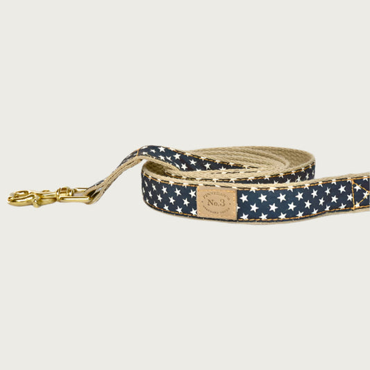 Deep navy blue dog leash with small repeating white star pattern.