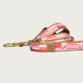 Load image into Gallery viewer, Dog leash with vertical, geometrical striped pattern in shades of orange, pink, and white.
