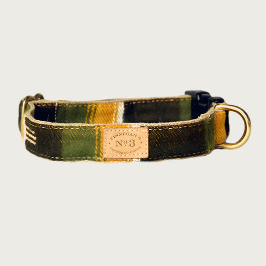 Dog collar with a wide-set plaid pattern, in earthy shades of olive green, black, and mustard yellow.