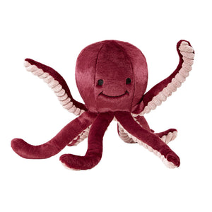 Plush Olympia Octopus dog toy from Fluff & Tuff. Its body is cranberry colored, with the underside of its legs a light pink with ribbed texture. It has a cute smiley face (eyes & mouth) embroidered in black on its head.