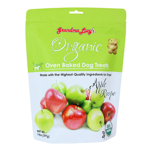 14 oz white & green apple colored bag of Grandma Lucy's Organic Oven Baked Dog Treats. Apple Recipe. Made with the highest-quality ingredients for dogs. Photo of a variety of apples is on the bottom half of the bag. A true to size image of the actual teddy bear shaped cookie treat, is near the brand name at top of bag. It's about 2" tall.