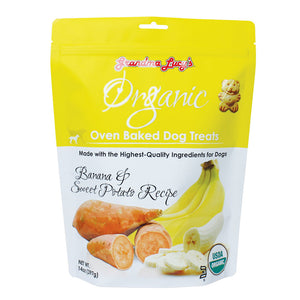 14 oz white & yellow colored bag of Grandma Lucy's Organic Oven Baked Dog Treats. Banana & sweet potato Recipe. Made with the highest-quality ingredients for dogs. Photo of a cut sweet potato and cut banana is on the bottom half of the bag. A true to size image of the actual teddy bear shaped cookie treat, is near the brand name at top of bag. It's about 2" tall.