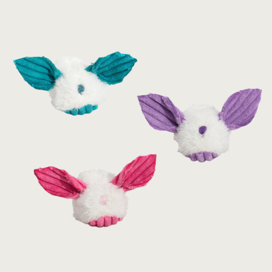 Three dust bunny toys pictured, to show color options. Body of the toy is white plush, accented with teal, purple or pink corduroy ears & belly and embroidered nose .