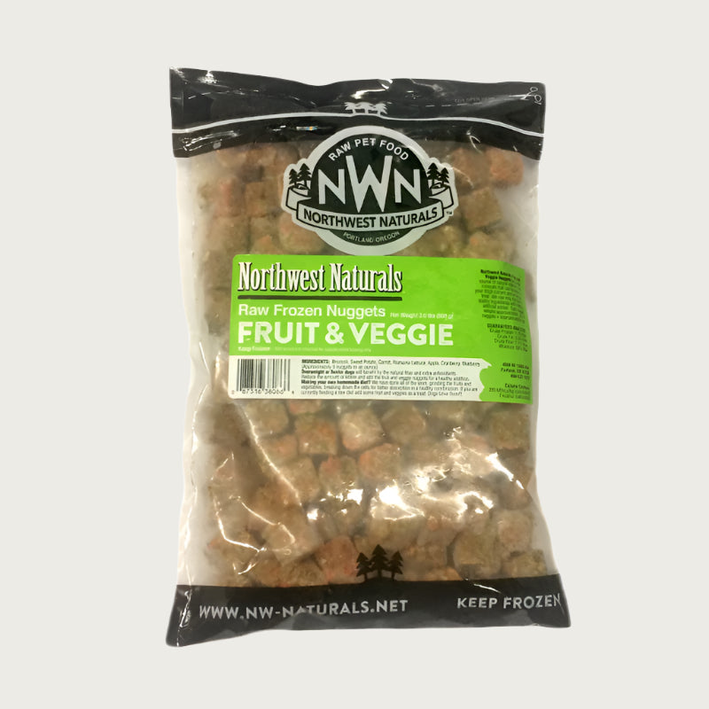 A 2 pound bag of Northwest Naturals frozen fruit and vegetable nugget treats for dogs. Bag is clear, and small cube-sized nuggets are visible.