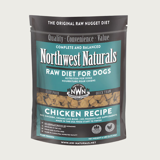 A 6 pound bag of Northwest Naturals frozen raw diet for dogs, chicken recipe. Clear window on bag shows small cube-sized nuggets.