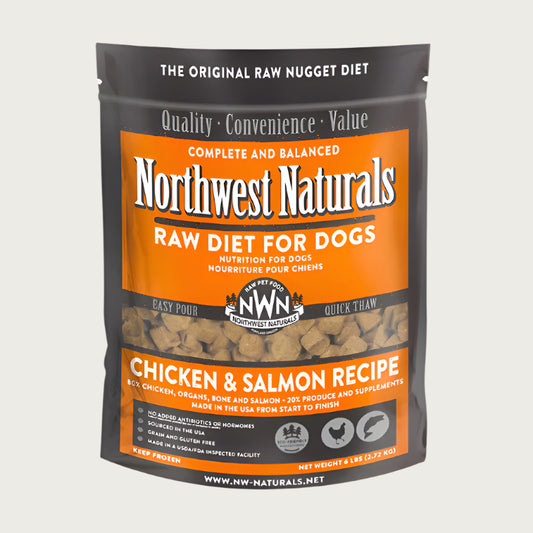 A 6 pound bag of Northwest Naturals frozen raw diet for dogs, chicken and salmon recipe. Clear window on bag shows small cube-sized nuggets.