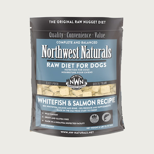 A 6 pound bag of Northwest Naturals frozen raw diet for dogs, whitefish and salmon recipe. Clear window on bag shows small cube-sized nuggets.
