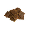 A close-up photo of a small handful of the Open Farm Beef dog treat. They are rectangular brown pieces that look like jerky, about 1"-2" long and 1/8" thick.