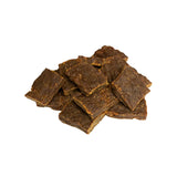 A close-up photo of a small handful of the Open Farm Beef dog treat. They are rectangular brown pieces that look like jerky, about 1"-2" long and 1/8" thick.