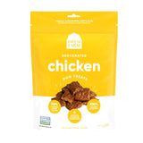 A 4.5 oz yellow & white bag of Open Farm Dehydrated Chicken Dog Treats. Small photo in center shows a close-up of a few of the jerky-style treats.