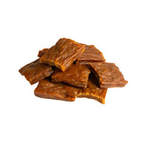 A close-up photo of a small handful of the Open Farm Turkey dog treat. They are rectangular brown pieces that look like jerky, about 1"-2" long and 1/8" thick.