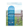 A bag of Open Farm Grain Free Whitefish Recipe cat food. Humanely and sustainably sourced. A photo of a tabby cat standing in a field on a farm covers the bag, with a blue bar behind the white text to highlight it.
