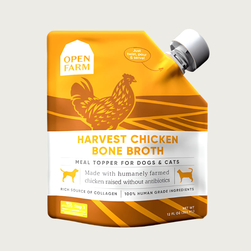 A 12 oz yellow & white pouch with spout, of Open Farm Harvest Chicken Bone Broth Meal Topper for Dogs & Cats. 